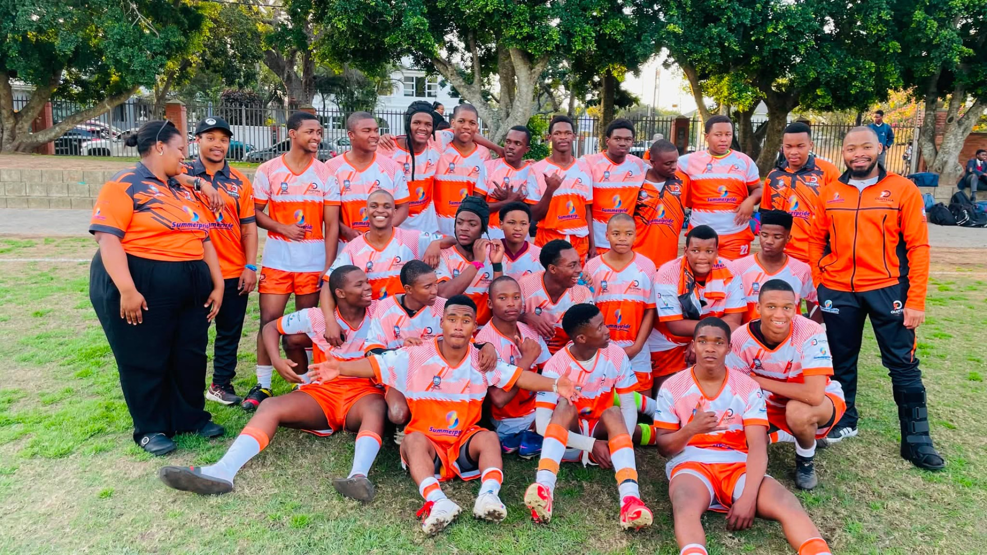 Olutsha Academy squad and coaches together in the 2026 Summerpride kit